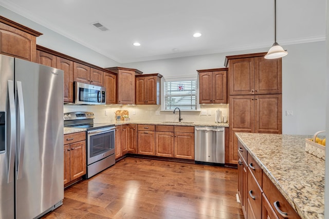 4801 Beryl Dr, Murfreesboro, TN 37128 - kitchen with appliances with stainless steel finishes, a sink, light stone countertops, crown molding, and decorative backsplash