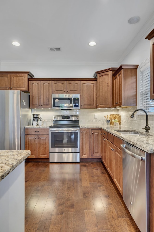 4801 Beryl Dr, Murfreesboro, TN 37128 - kitchen featuring stainless steel appliances, a sink, dark wood finished floors, light stone countertops, and backsplash