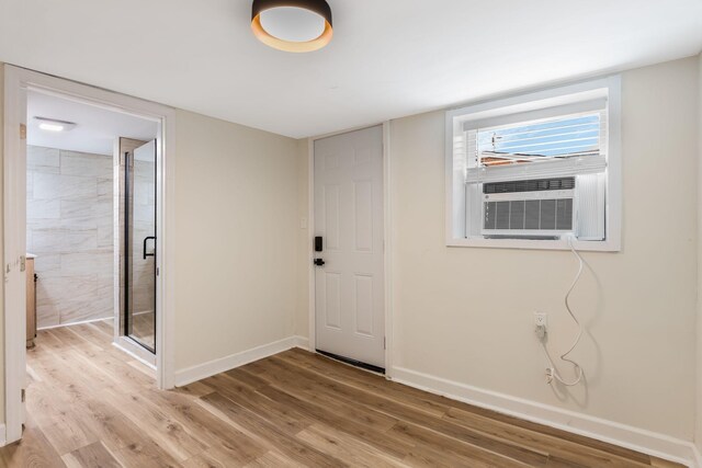 1607 Wheless St, Nashville, TN 37208 - foyer entrance with baseboards, light wood-style floors, and cooling unit