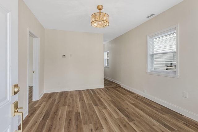 1607 Wheless St, Nashville, TN 37208 - spare room featuring a chandelier, wood finished floors, and baseboards
