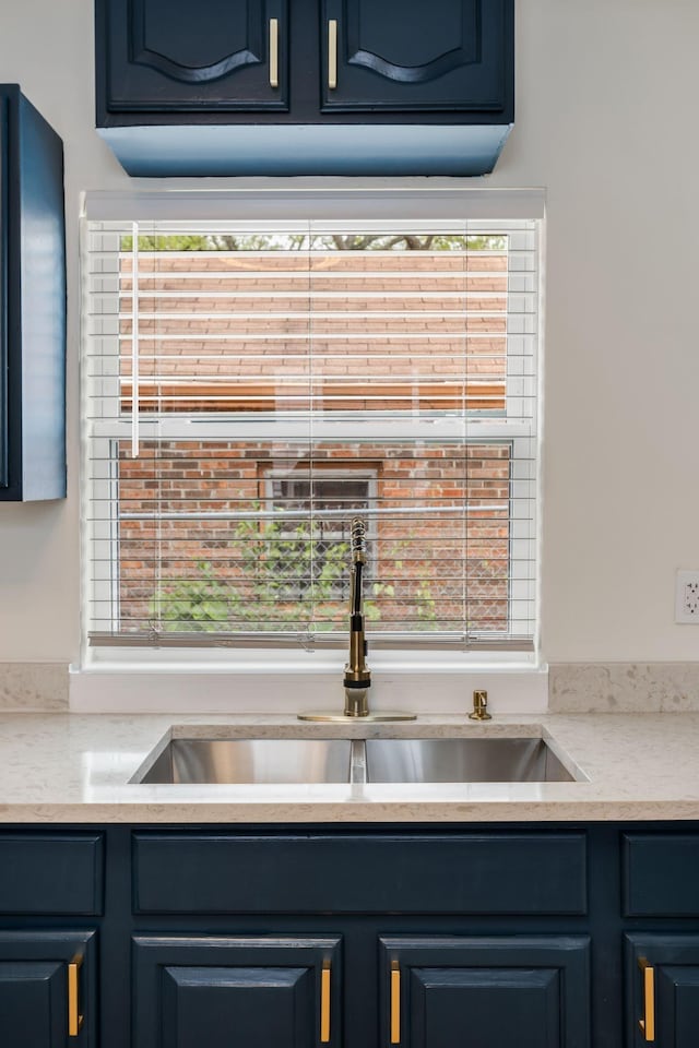 1607 Wheless St, Nashville, TN 37208 - kitchen view of blue cabinets, a sink, and light countertops