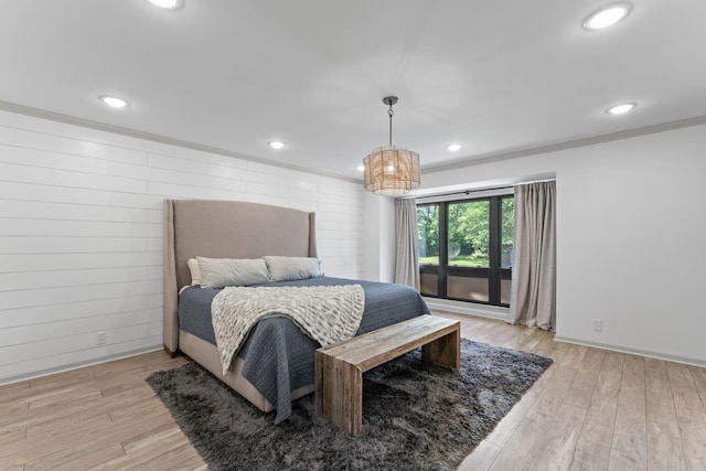 bedroom with light wood-type flooring, recessed lighting, baseboards, and ornamental molding