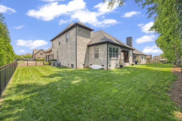 2979 Stewart Campbell Pt, Spring Hill, TN 37174 - rear view of house featuring brick siding, crawl space, a chimney, and central AC unit
