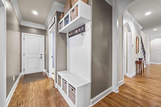 2979 Stewart Campbell Pt, Spring Hill, TN 37174 - mudroom featuring arched walkways, crown molding, wood finished floors, baseboards, and recessed lighting