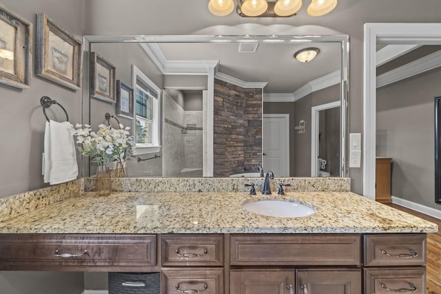 2979 Stewart Campbell Pt, Spring Hill, TN 37174 - bathroom with a tile shower, vanity, crown molding, wood finished floors, and toilet