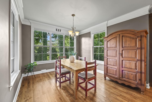 2979 Stewart Campbell Pt, Spring Hill, TN 37174 - dining area with crown molding, baseboards, a chandelier, and wood finished floors