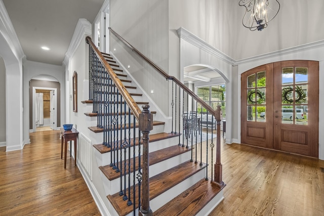 2979 Stewart Campbell Pt, Spring Hill, TN 37174 - entryway featuring arched walkways, french doors, wood finished floors, baseboards, and a towering ceiling