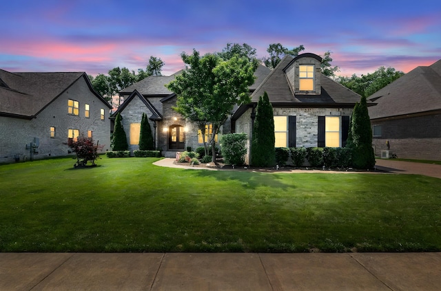 2979 Stewart Campbell Pt, Spring Hill, TN 37174 - french country home with stone siding and a front lawn