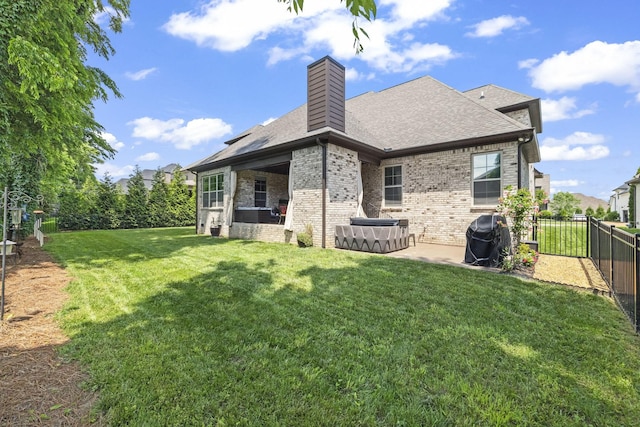 2979 Stewart Campbell Pt, Spring Hill, TN 37174 - rear view of property featuring a patio area, brick siding, a chimney, and a shingled roof