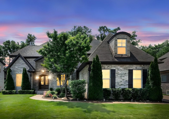2979 Stewart Campbell Pt, Spring Hill, TN 37174 - french provincial home featuring a front lawn, stone siding, and brick siding