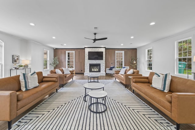 2979 Stewart Campbell Pt, Spring Hill, TN 37174 - living area with recessed lighting, ornamental molding, a fireplace, a ceiling fan, and wood finished floors