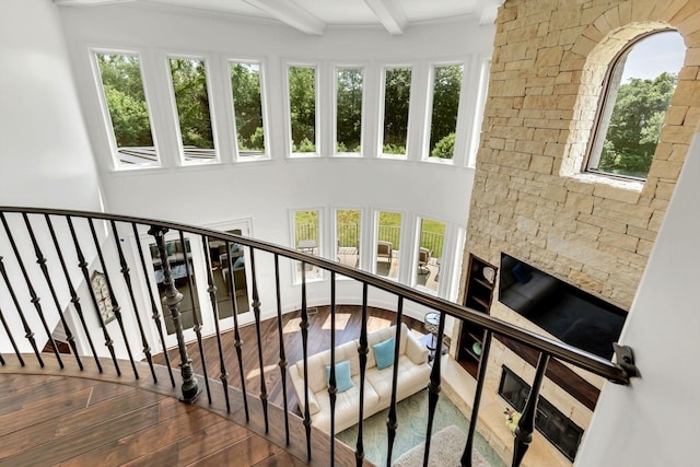 1477 S Harpeth Rd, Kingston Springs, TN 37082 - stairway with beamed ceiling, hardwood / wood-style flooring, and a towering ceiling