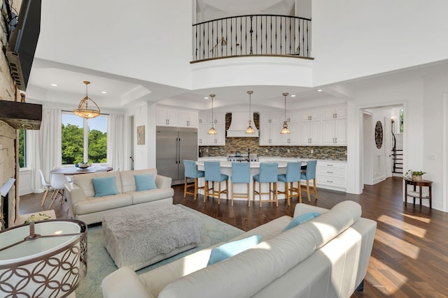 1477 S Harpeth Rd, Kingston Springs, TN 37082 - living area featuring dark wood-style floors, recessed lighting, a towering ceiling, and stairs