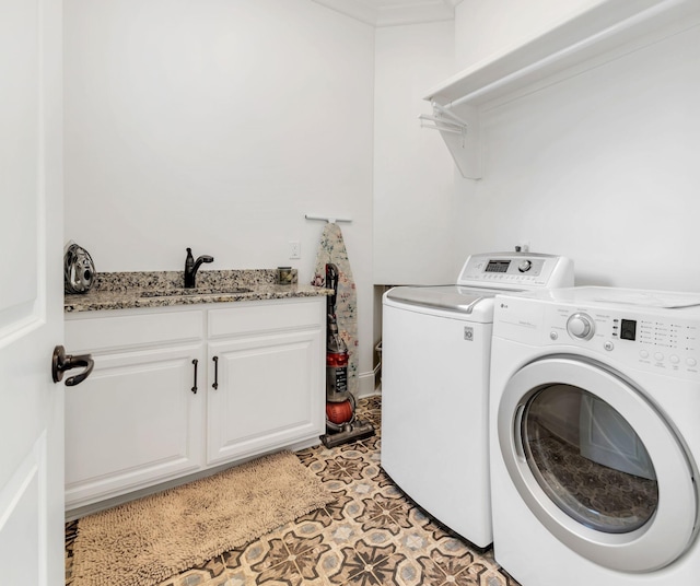 1477 S Harpeth Rd, Kingston Springs, TN 37082 - laundry area with washing machine and dryer, cabinet space, and light tile patterned floors