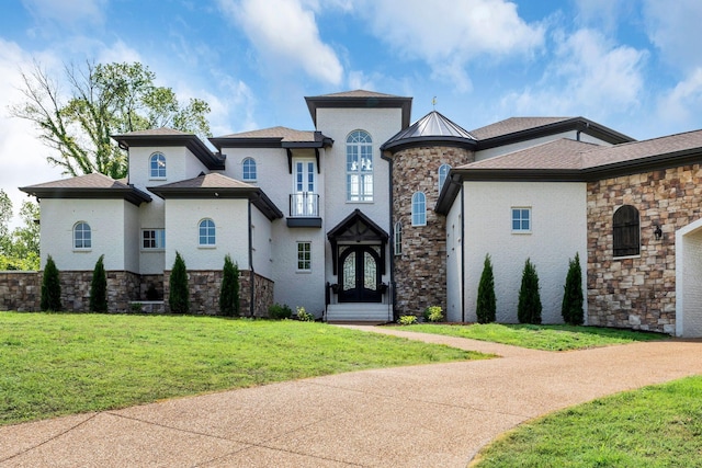 1477 S Harpeth Rd, Kingston Springs, TN 37082 - french country inspired facade with french doors, a front lawn, and stone siding