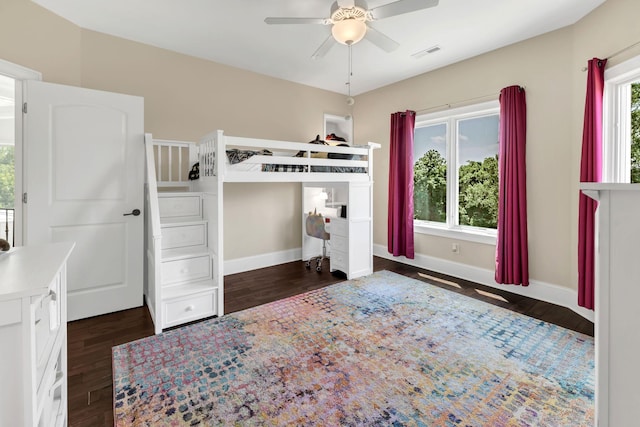 1477 S Harpeth Rd, Kingston Springs, TN 37082 - unfurnished bedroom with dark wood-style floors, baseboards, and a ceiling fan