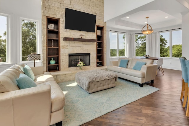 1477 S Harpeth Rd, Kingston Springs, TN 37082 - living area with plenty of natural light, wood-type flooring, a stone fireplace, and a raised ceiling