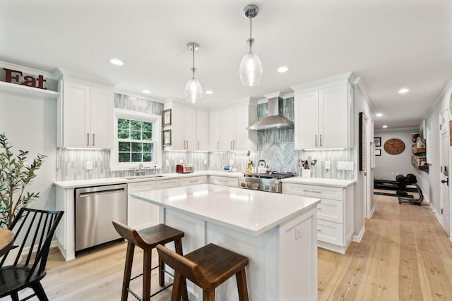 8757 Horton Hwy, College Grove, TN 37046 - kitchen with dishwasher, wall chimney exhaust hood, light wood-type flooring, stove, and white cabinets