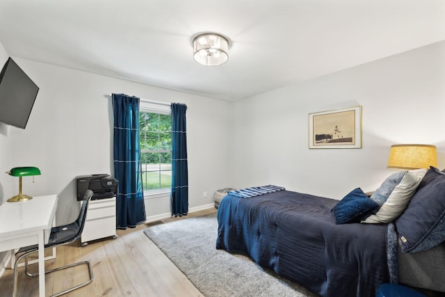 8757 Horton Hwy, College Grove, TN 37046 - bedroom featuring light wood-style flooring, an office area, and baseboards