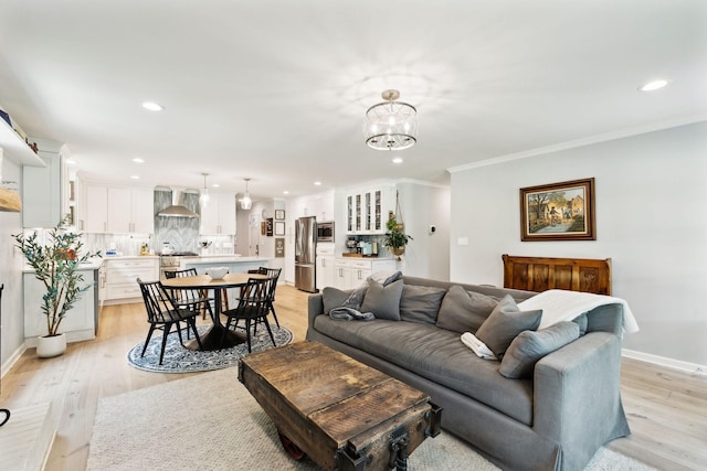 8757 Horton Hwy, College Grove, TN 37046 - living area featuring recessed lighting, light wood-style flooring, baseboards, crown molding, and a chandelier
