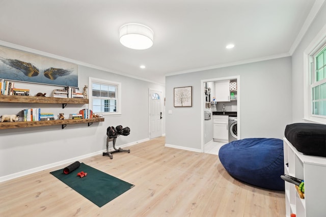 8757 Horton Hwy, College Grove, TN 37046 - exercise area featuring washer / clothes dryer, ornamental molding, light wood finished floors, baseboards, and recessed lighting