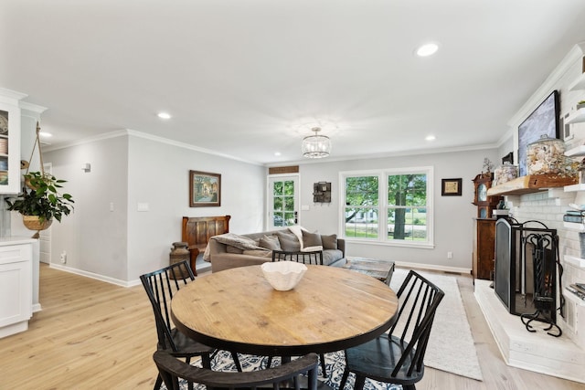 8757 Horton Hwy, College Grove, TN 37046 - dining room with recessed lighting, light wood-style flooring, crown molding, a fireplace, and baseboards