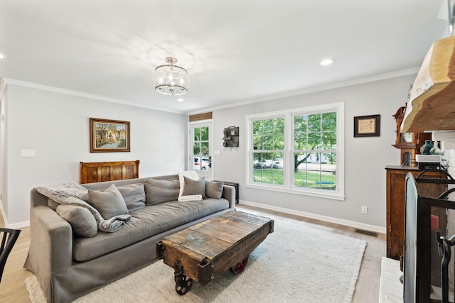 8757 Horton Hwy, College Grove, TN 37046 - living room with ornamental molding, light wood finished floors, recessed lighting, baseboards, and a chandelier