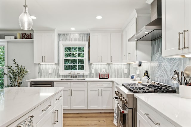 8757 Horton Hwy, College Grove, TN 37046 - kitchen featuring wall chimney range hood, high end stainless steel range oven, a sink, white cabinets, and recessed lighting