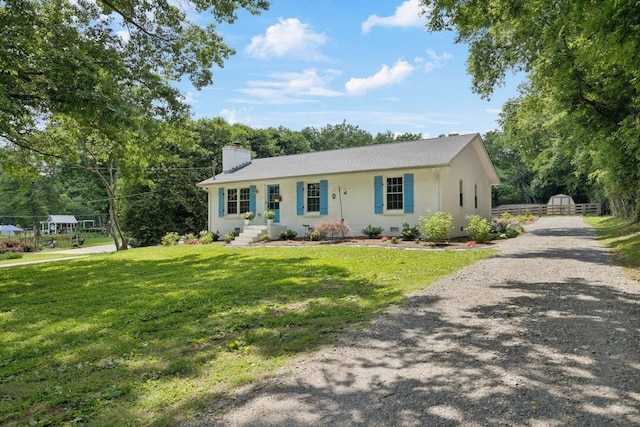 8757 Horton Hwy, College Grove, TN 37046 - single story home with a chimney, a front lawn, gravel driveway, and an outdoor structure