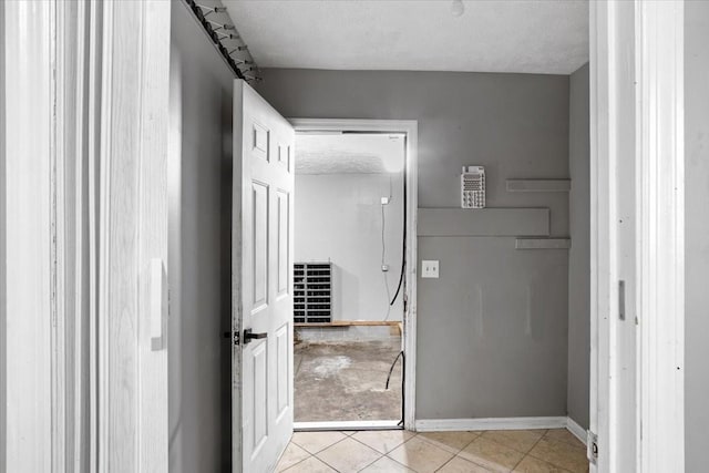 1306 Cason Trl, Murfreesboro, TN 37128 - corridor with light tile patterned flooring, a textured ceiling, and baseboards