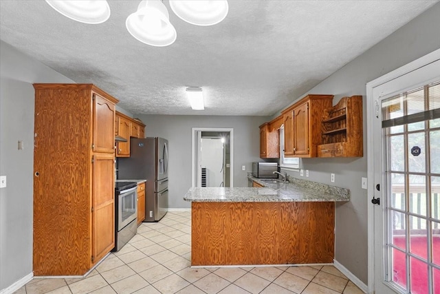 1306 Cason Trl, Murfreesboro, TN 37128 - kitchen with appliances with stainless steel finishes, a peninsula, light countertops, brown cabinetry, and open shelves