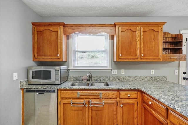 1306 Cason Trl, Murfreesboro, TN 37128 - kitchen featuring stainless steel dishwasher, a sink, brown cabinetry, open shelves, and light stone countertops