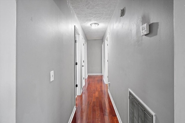 1306 Cason Trl, Murfreesboro, TN 37128 - corridor featuring a textured ceiling, baseboards, and wood finished floors