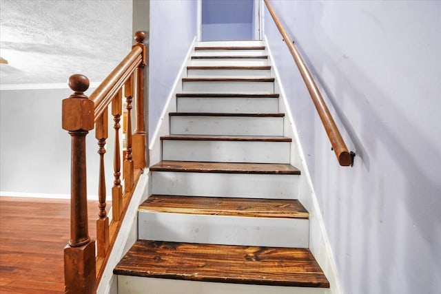 1306 Cason Trl, Murfreesboro, TN 37128 - stairs featuring wood finished floors, ornamental molding, and a textured ceiling