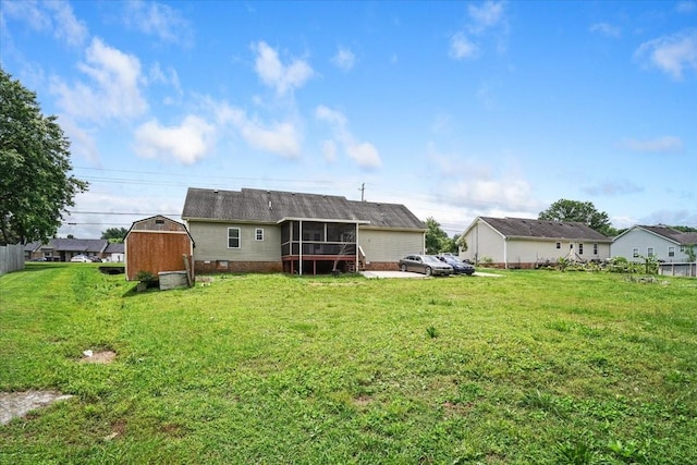 1306 Cason Trl, Murfreesboro, TN 37128 - rear view of property featuring a sunroom, a storage shed, an outbuilding, and a lawn