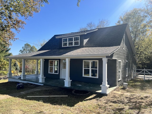 2863 Sweethome Rd, Chapmansboro, TN 37035 - view of front of house featuring covered porch, fence, and roof with shingles