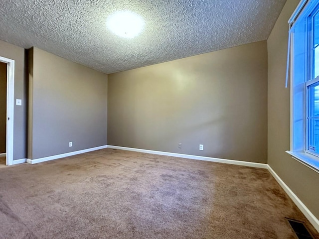 202 Jenna Ave, Oak Grove, KY 42262 - unfurnished room with carpet flooring, a textured ceiling, and baseboards