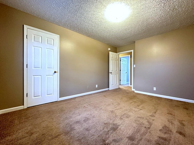 202 Jenna Ave, Oak Grove, KY 42262 - empty room featuring carpet, baseboards, and a textured ceiling