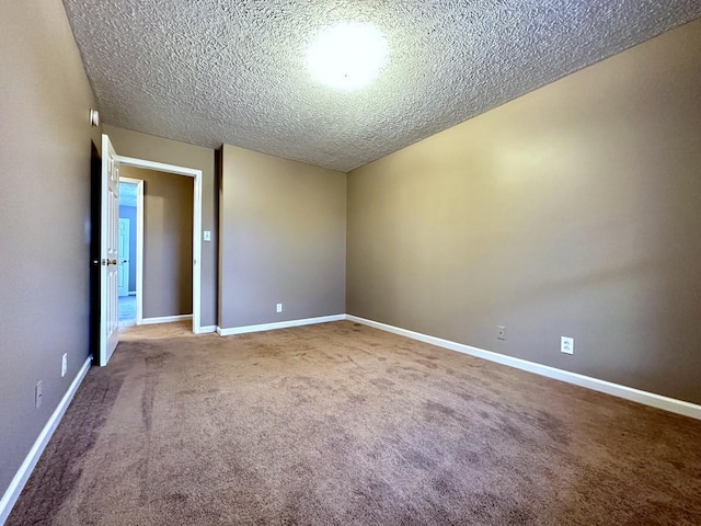 202 Jenna Ave, Oak Grove, KY 42262 - empty room with a textured ceiling, carpet floors, and baseboards
