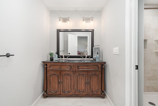 4851 Bethesda Duplex Rd, College Grove, TN 37046 - bathroom featuring double vanity, baseboards, and tiled shower