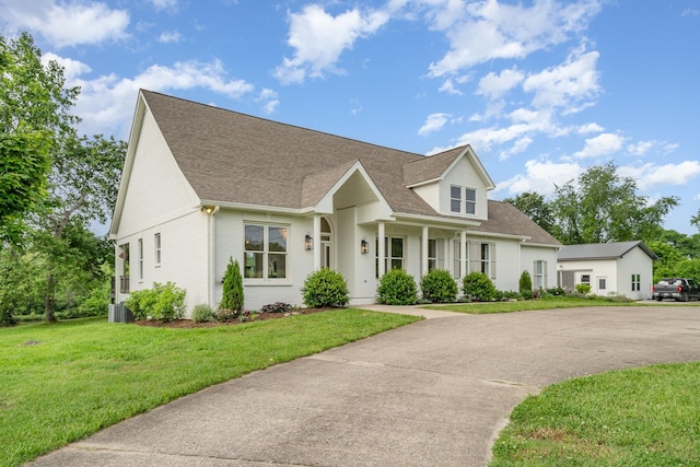 4851 Bethesda Duplex Rd, College Grove, TN 37046 - cape cod-style house with a shingled roof, a front lawn, brick siding, and central air condition unit