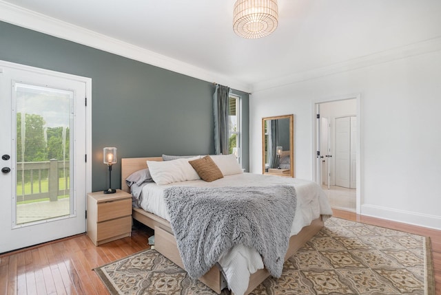 4851 Bethesda Duplex Rd, College Grove, TN 37046 - bedroom with crown molding, access to outside, light wood finished floors, and baseboards