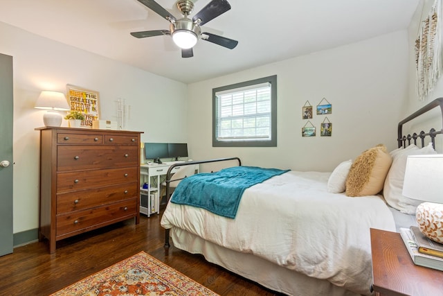 bedroom with wood finished floors, ceiling fan, and a desk