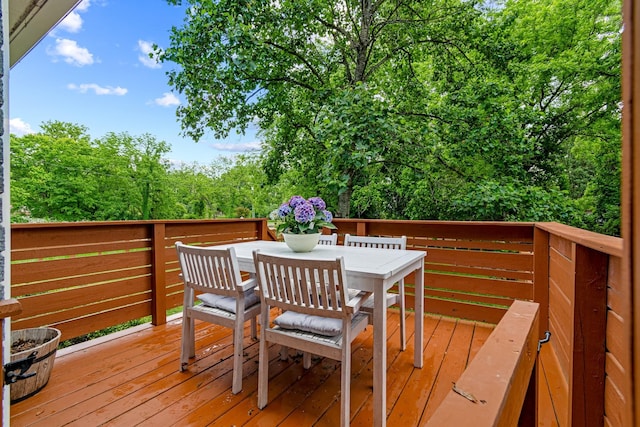 wooden deck with outdoor dining space