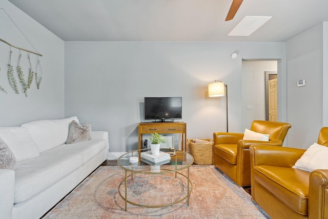 living area featuring ceiling fan and wood finished floors