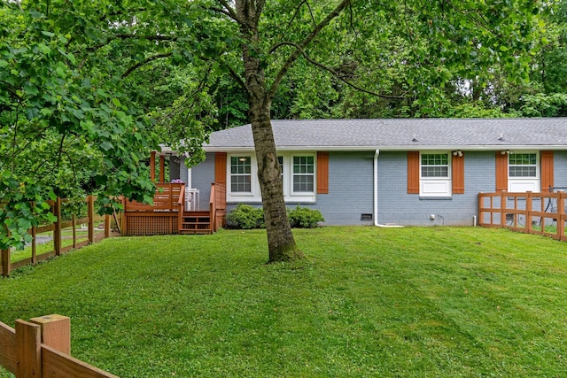 back of property with crawl space, a wooden deck, a shingled roof, and brick siding