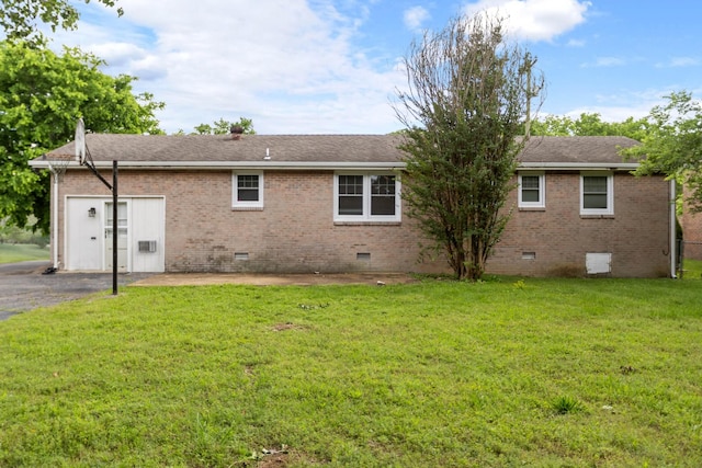 back of house with crawl space, brick siding, a lawn, and a shingled roof