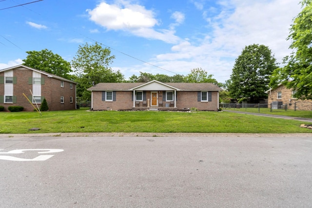 ranch-style home with a porch and brick siding