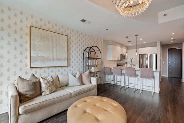 1510 Demonbreun St Unit 1012, Nashville, TN 37203 - living area with wallpapered walls, dark wood finished floors, a chandelier, recessed lighting, and baseboards