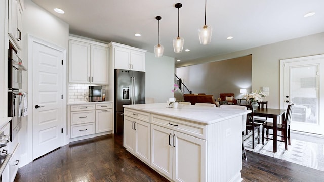 203 W Chandler Ct, Mount Juliet, TN 37122 - kitchen featuring high end refrigerator, dark wood-type flooring, backsplash, decorative light fixtures, and white cabinetry